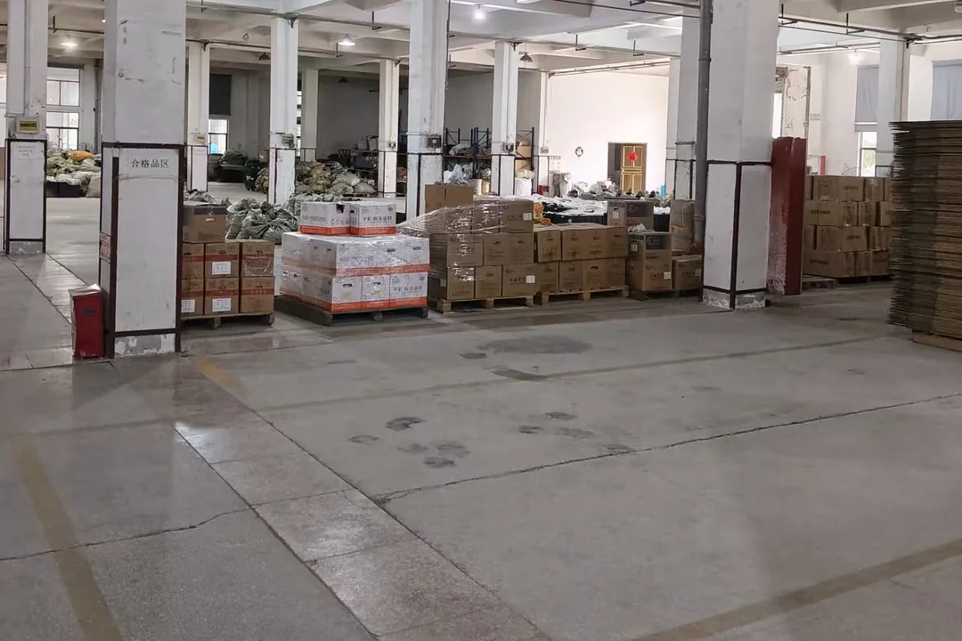 Packing bay, cartons palletised for container loading
